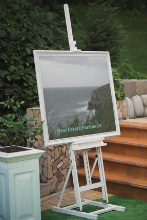 Seaside Serenity Thin canvas with realestatepartner24 with house Logo