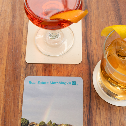The Rainbow Sinari Cork-back coaster with Real Estate Matching24 Logo