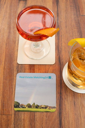 The Rainbow Sinari Cork-back coaster with Real Estate Matching24 Logo