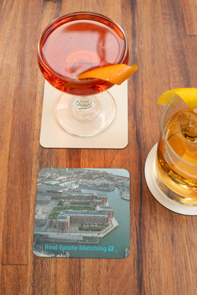 Nice City Cork-back coaster with realestatematching with key Logo